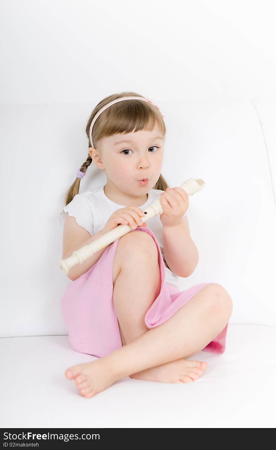 Sweet happy little girl with instrument