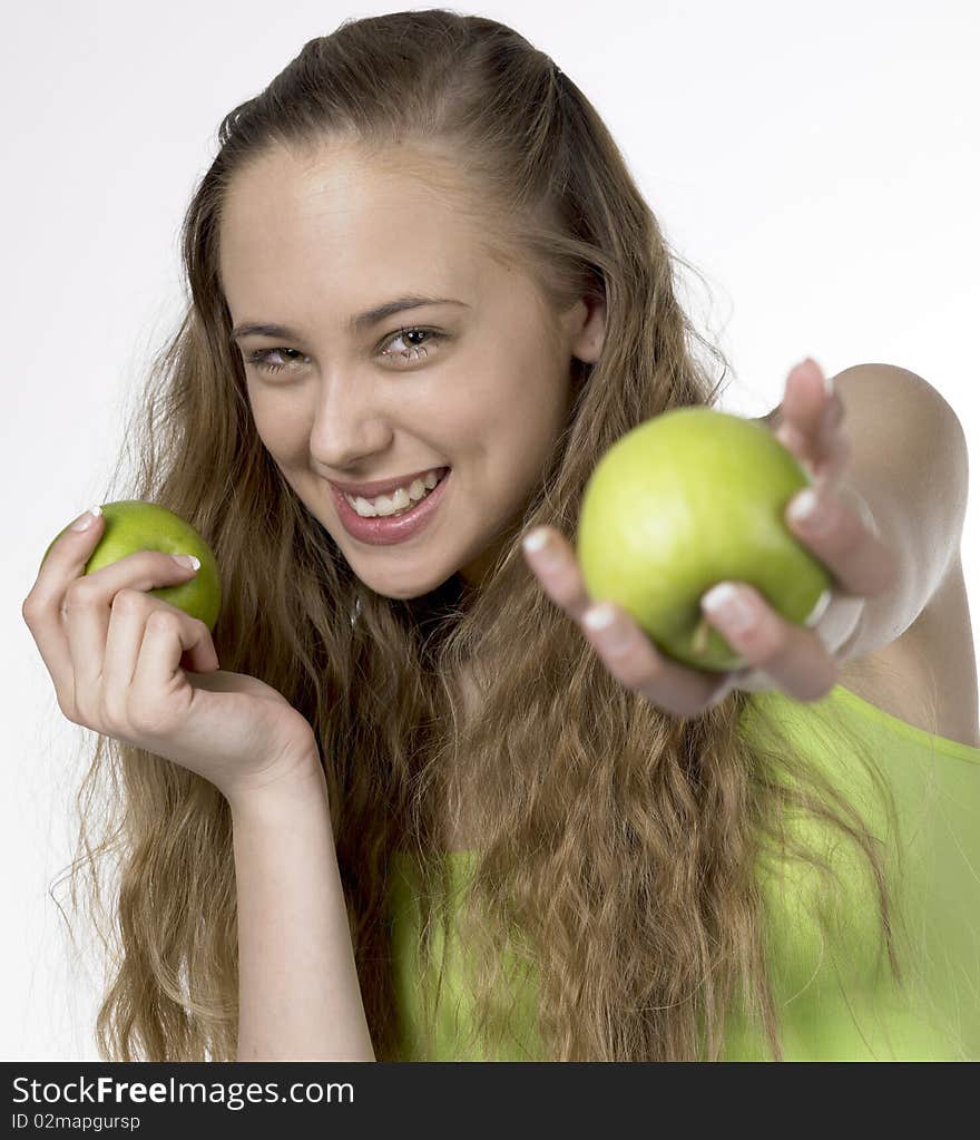 Portrait of young woman with apples