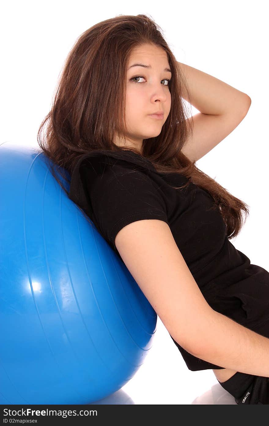 Girl about a gymnastic ball, isolated.