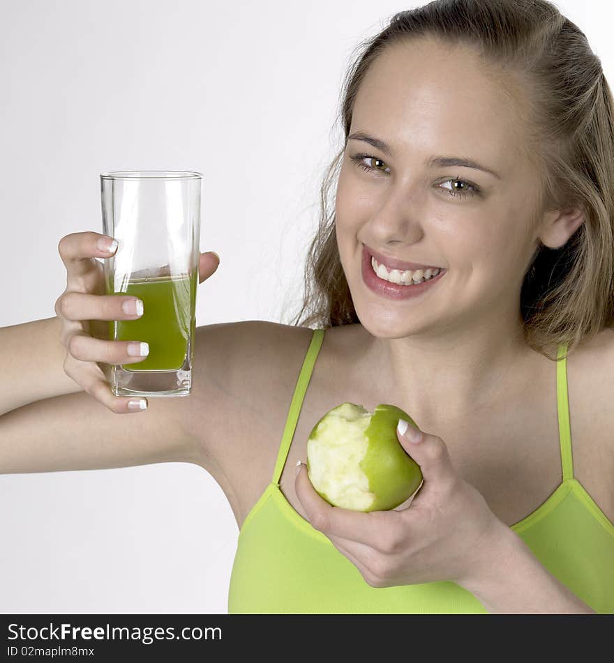 Woman with an apple and a glass of juice