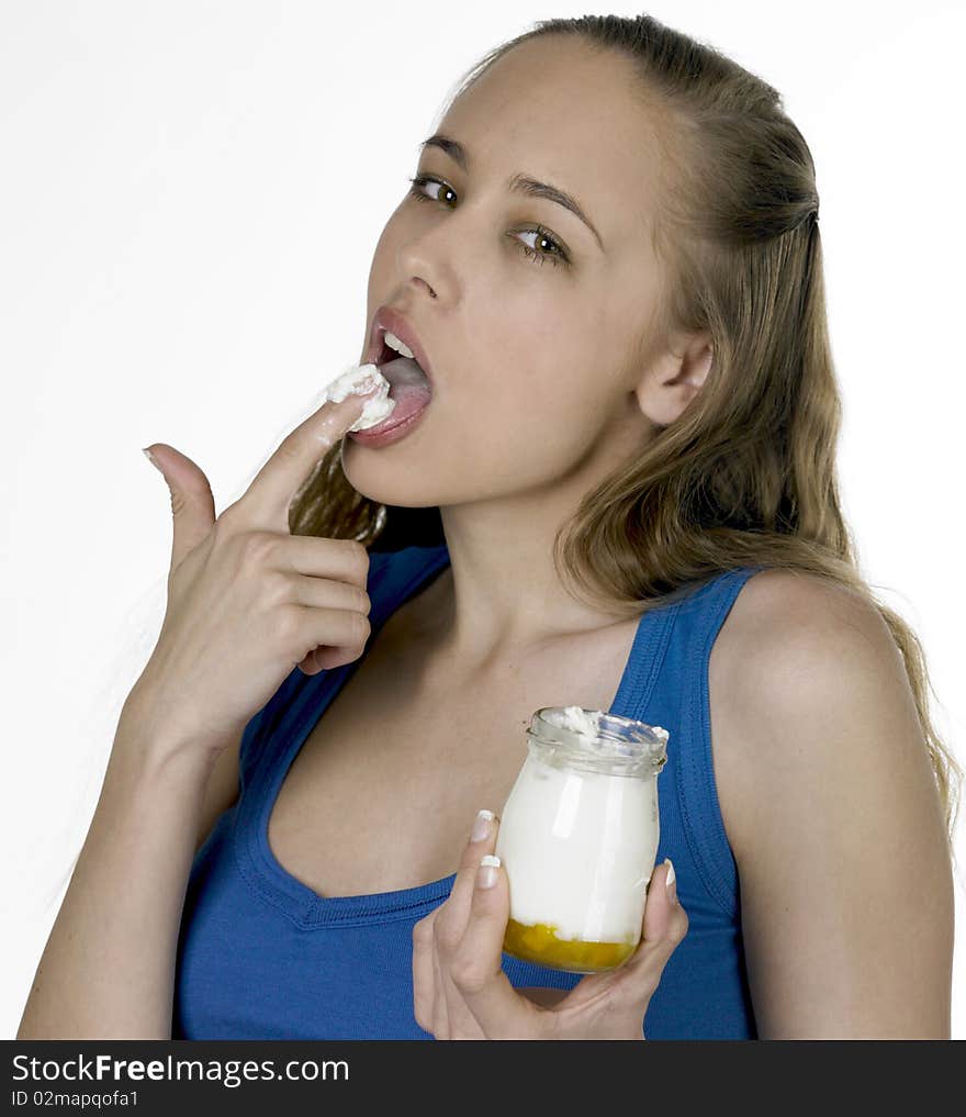 Portrait of woman eating yogurt. Portrait of woman eating yogurt