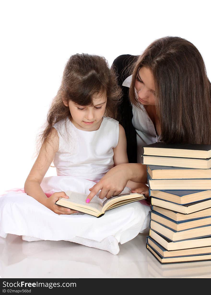 Two sisters with books, on a white background, it is isolated. Two sisters with books, on a white background, it is isolated.