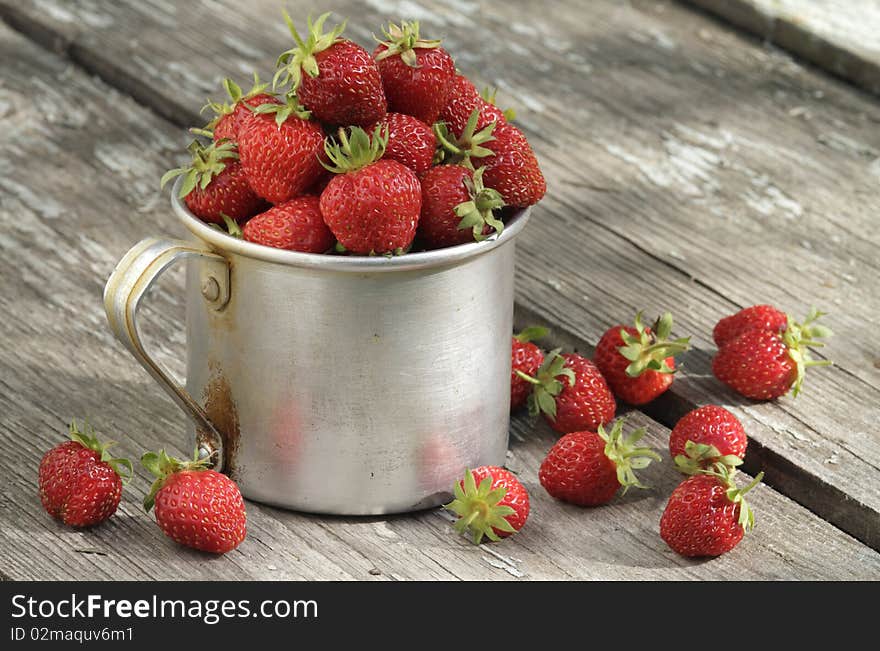 Garden strawberries in mug