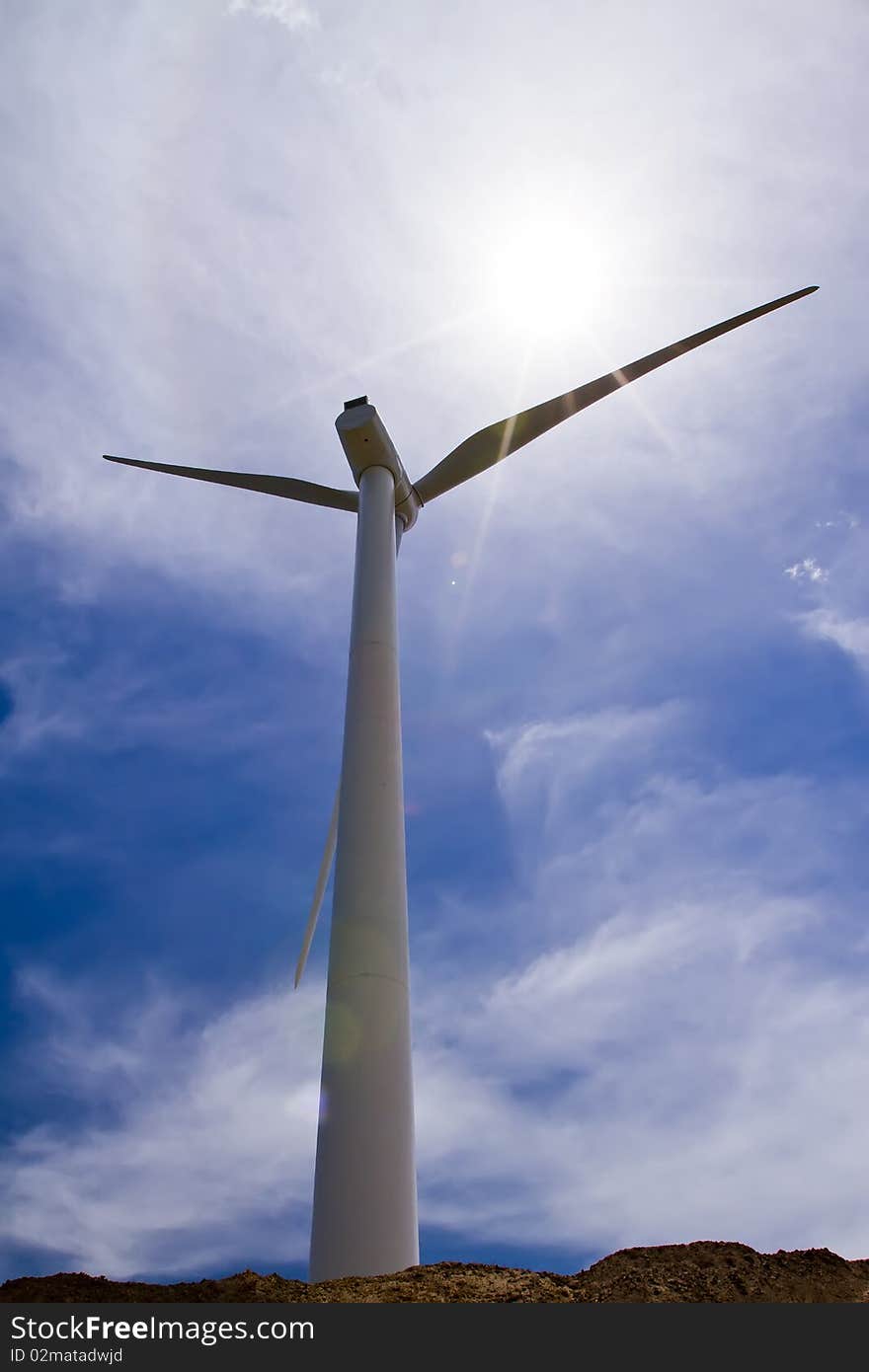 Wind Driven Generator standing under the bright sunshine for a clean environment.