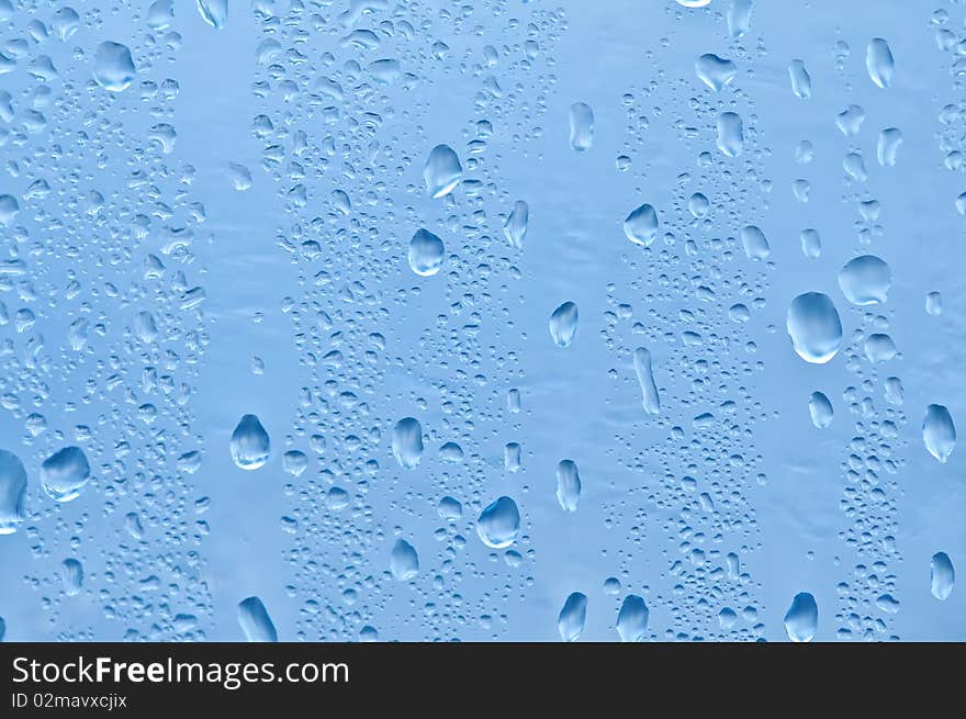 Water bubbles on the window for background. Water bubbles on the window for background