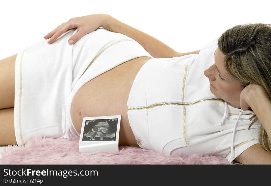 Pregnant woman with a sonogram of her baby