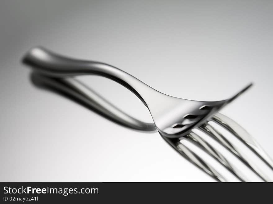 Steel Fork on a mirror. Steel Fork on a mirror