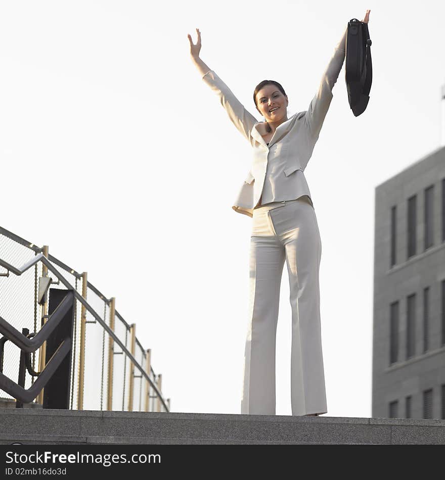 Standing businesswoman with a notebook