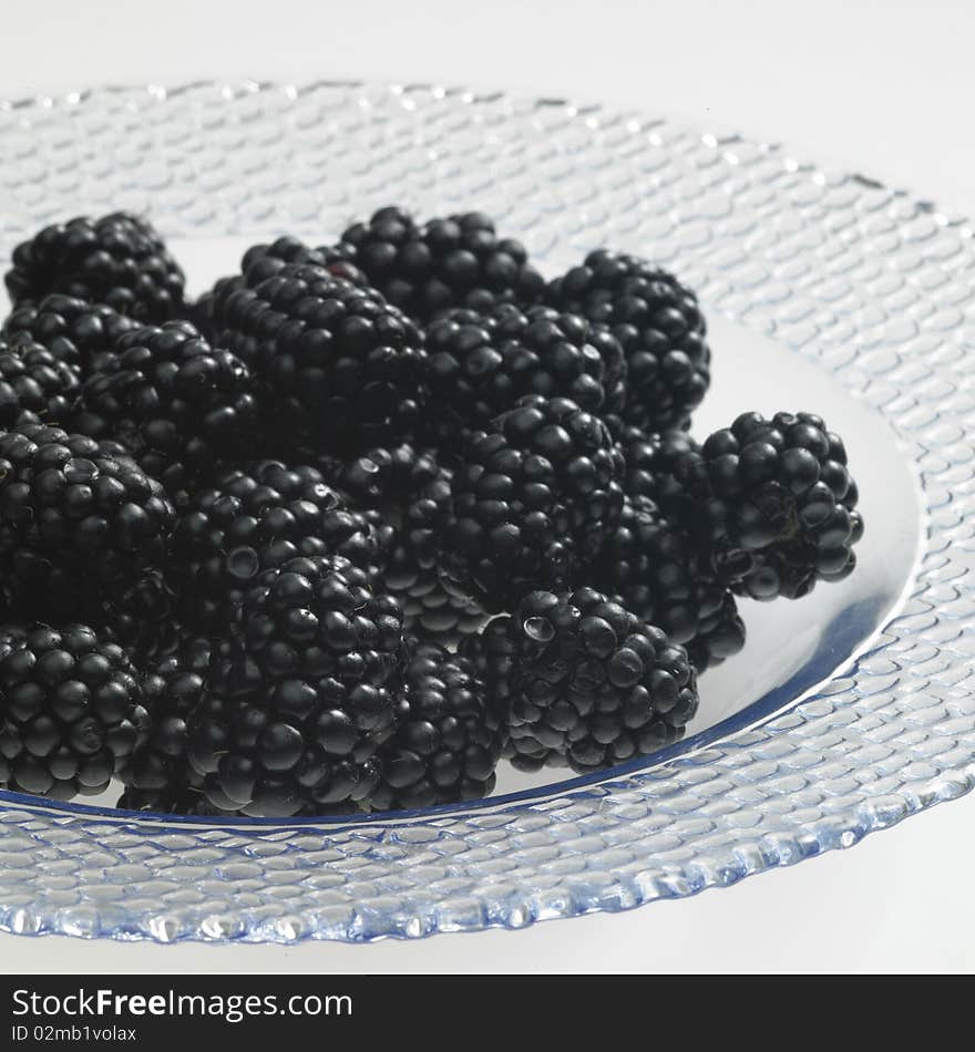 Still life of blackberries on a plate