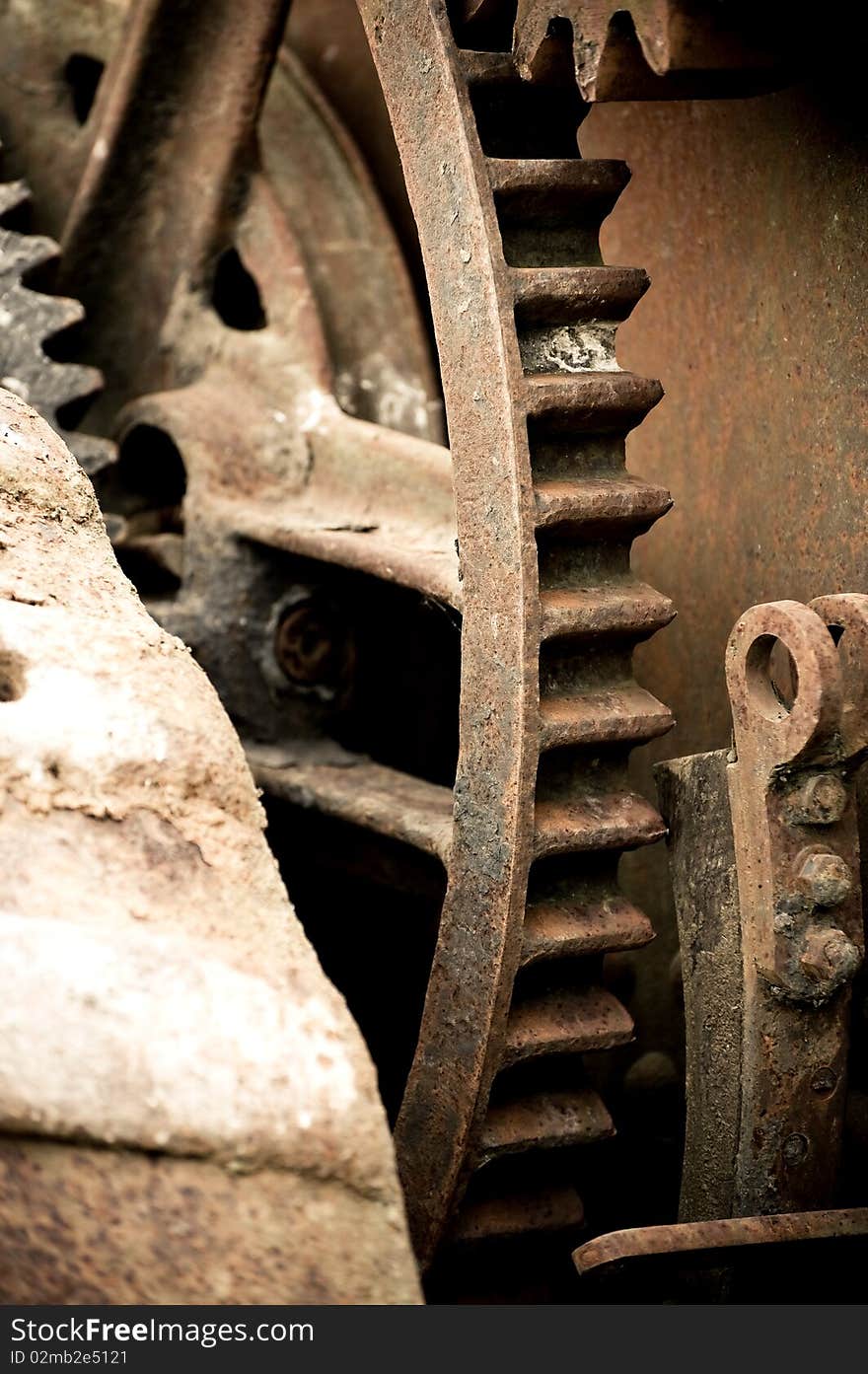 Rusting old industrial machine cog wheel background. Rusting old industrial machine cog wheel background