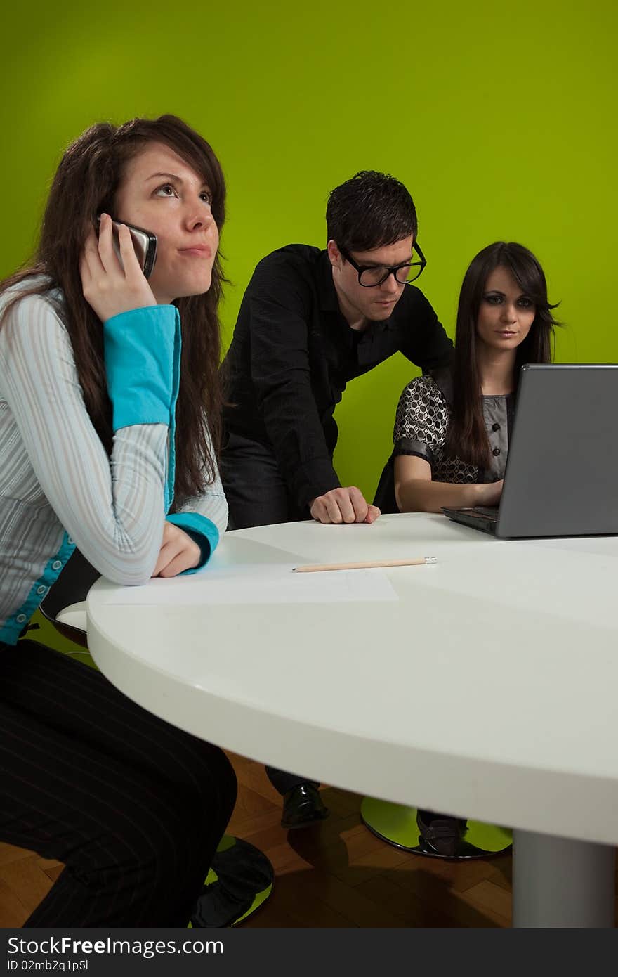 Three young people working in the office. Three young people working in the office