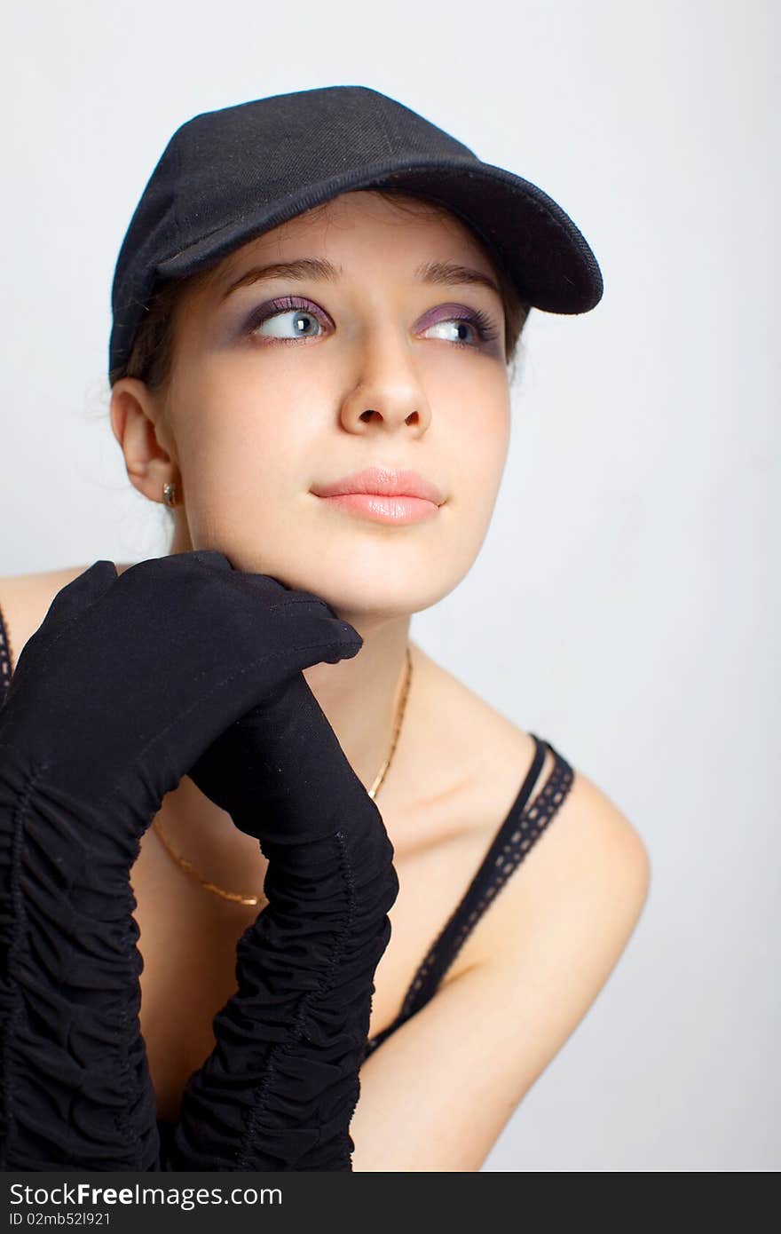 Sexy girl in a black clothing on a white background