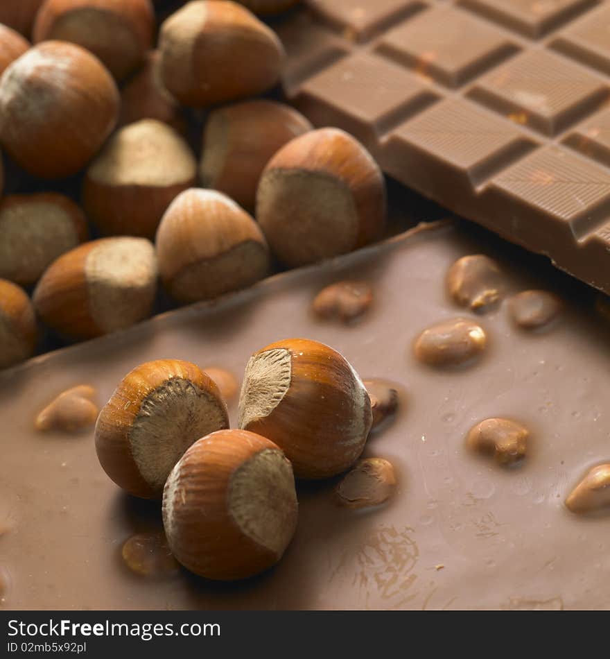 Still  life of chocolate bars with hazelnuts