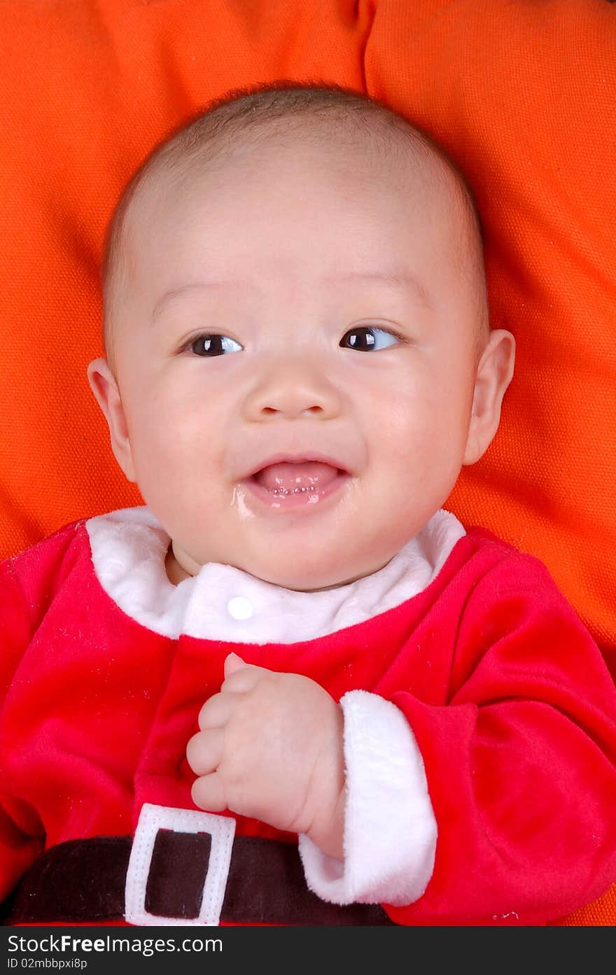 The Chinese infant baby boy smiling. The Chinese infant baby boy smiling