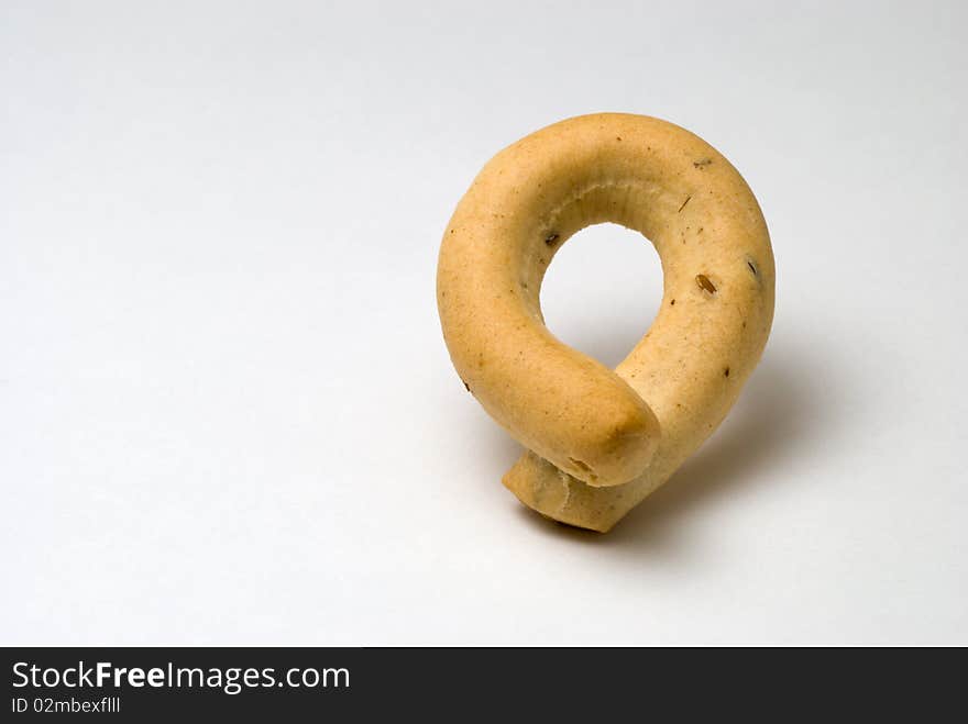 Crusty single bagel in band shape. Crusty single bagel in band shape