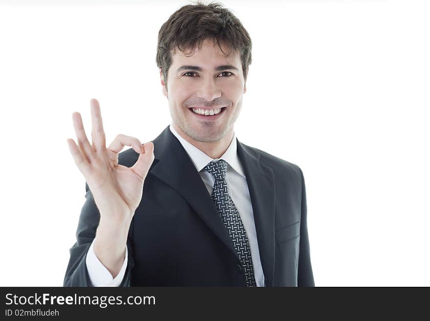 Businessman showing OK sign, white background