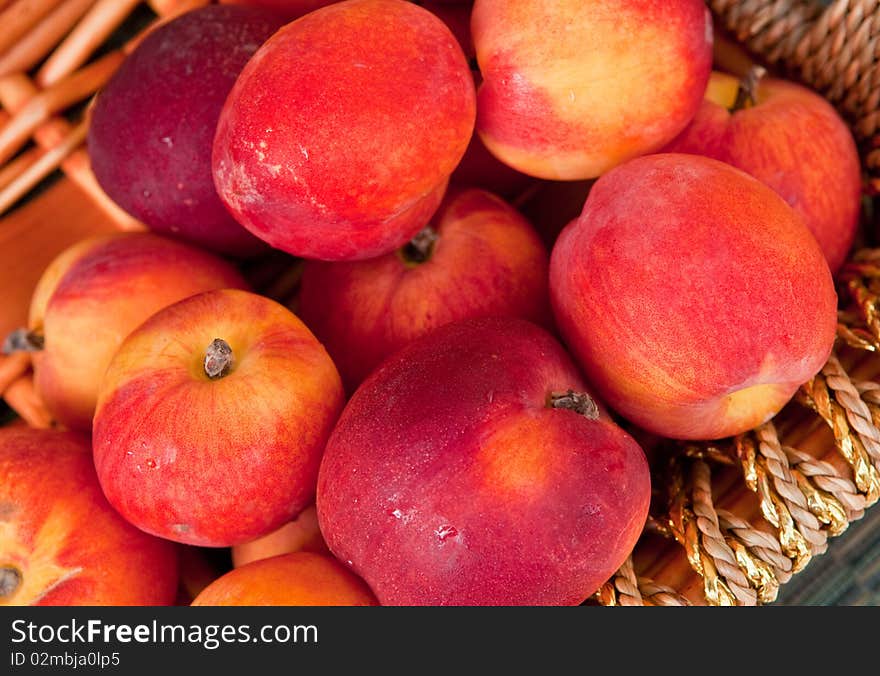 A basket of fresh nectarines plucked straight from the orchard