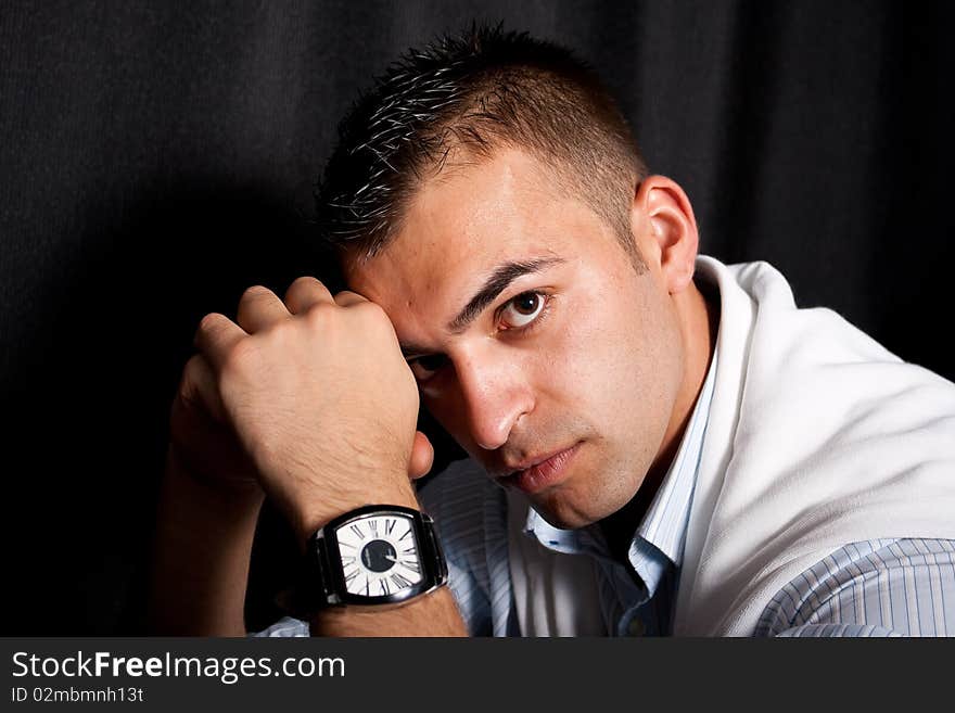 Young man sitting on an armchair. Young man sitting on an armchair