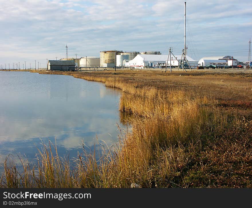 Oil terminal and grass in the evening light.