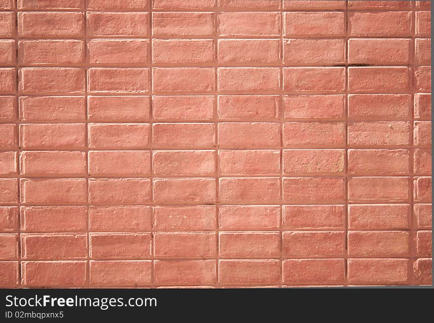 Rectangular red brick wall with strong lighting