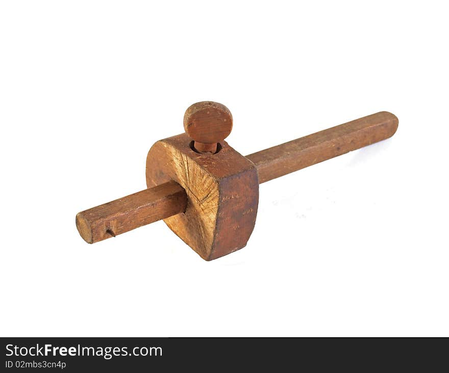 Old gauge used by carpenters on a plain white background.