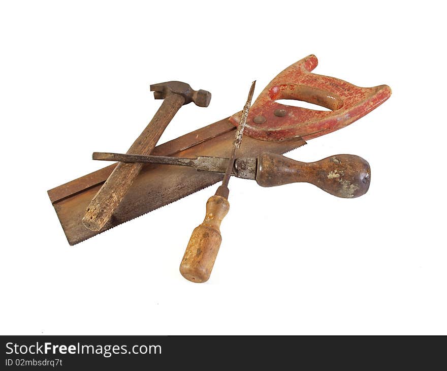 Assorted old hand tools on a plain white background.