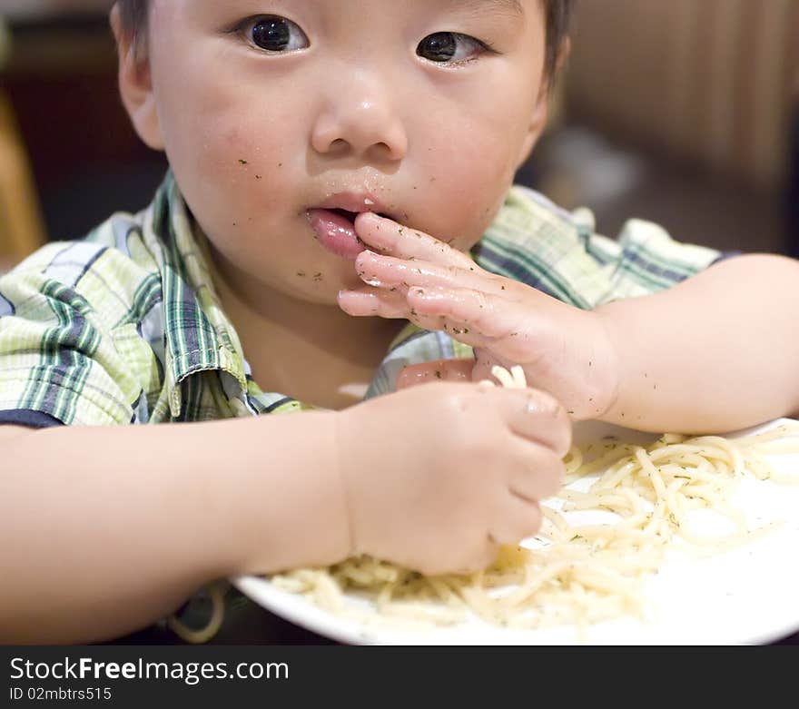 Eating baby to grab pasta