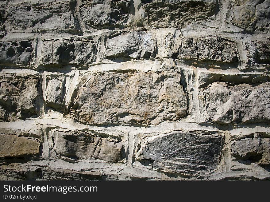 Background stone wall with brighter center. Background stone wall with brighter center