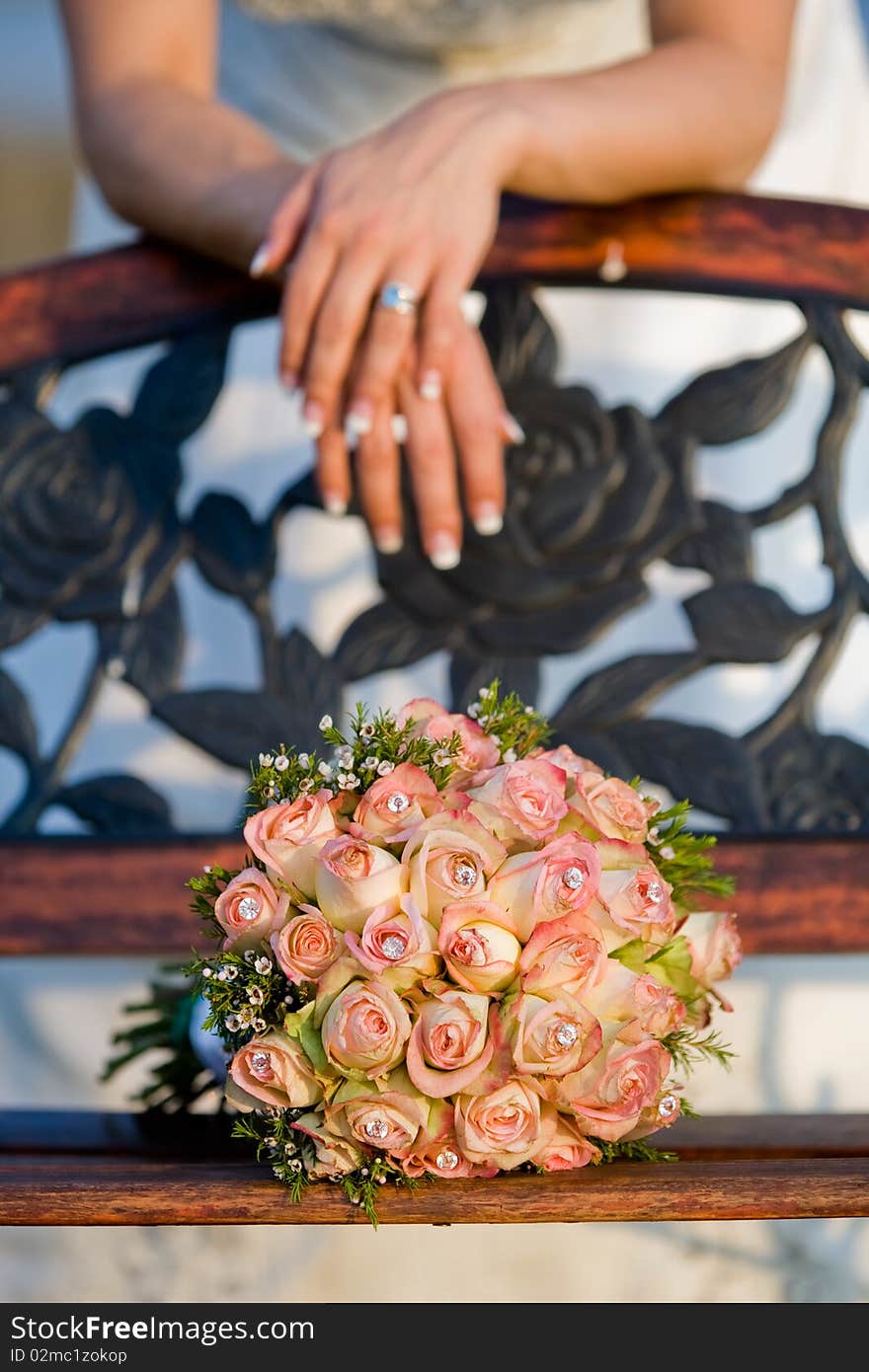 Bride with bench and bouquet