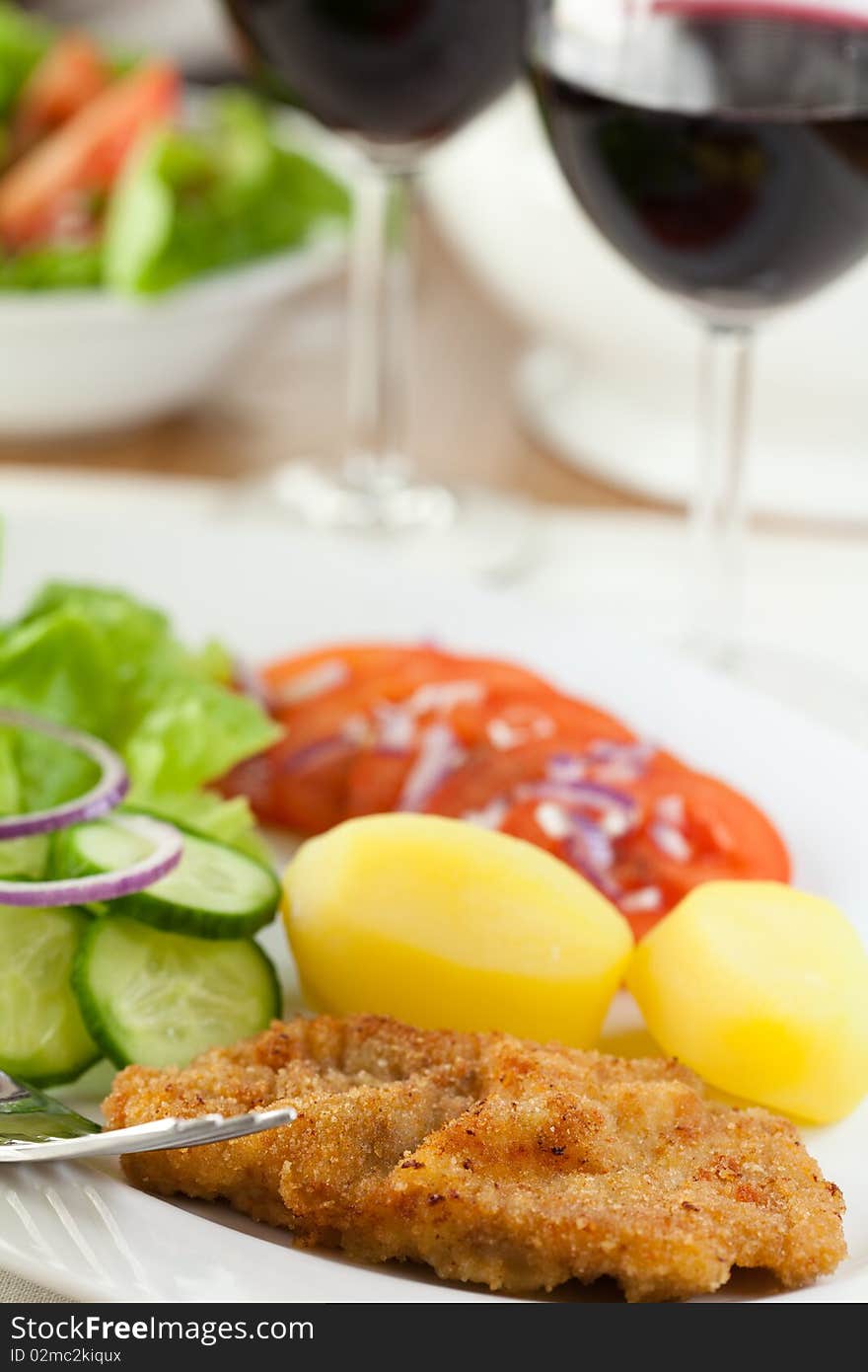 Schnitzel With Potatoes And Salad