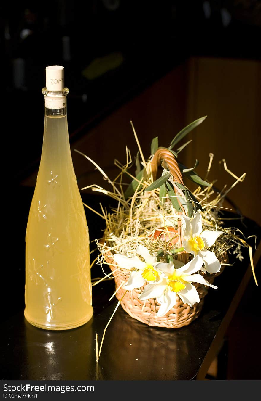 Easter basket with a bottle of white wine. Easter basket with a bottle of white wine