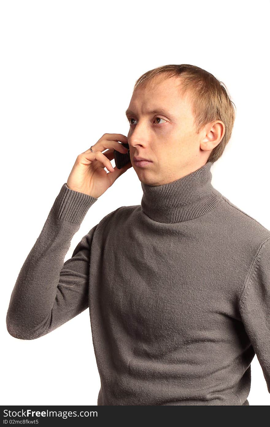 Confident strong man call on the phone and looking sideways isolated on a white background