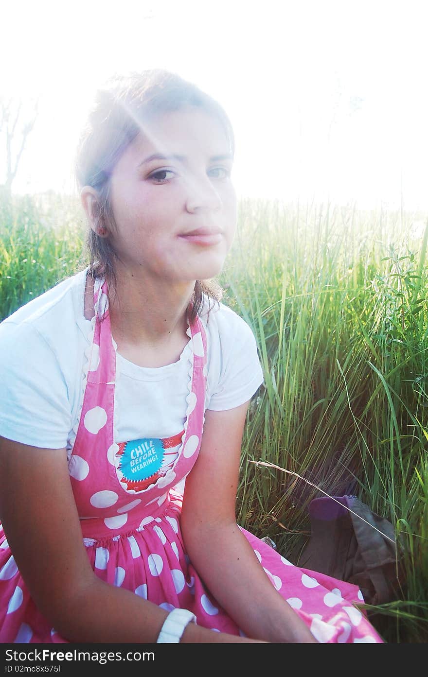 Young girl in summer meadow