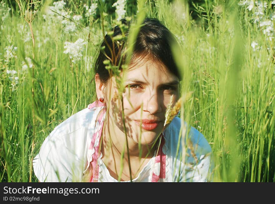 Portrait of a young girl in a summer meadow. Portrait of a young girl in a summer meadow