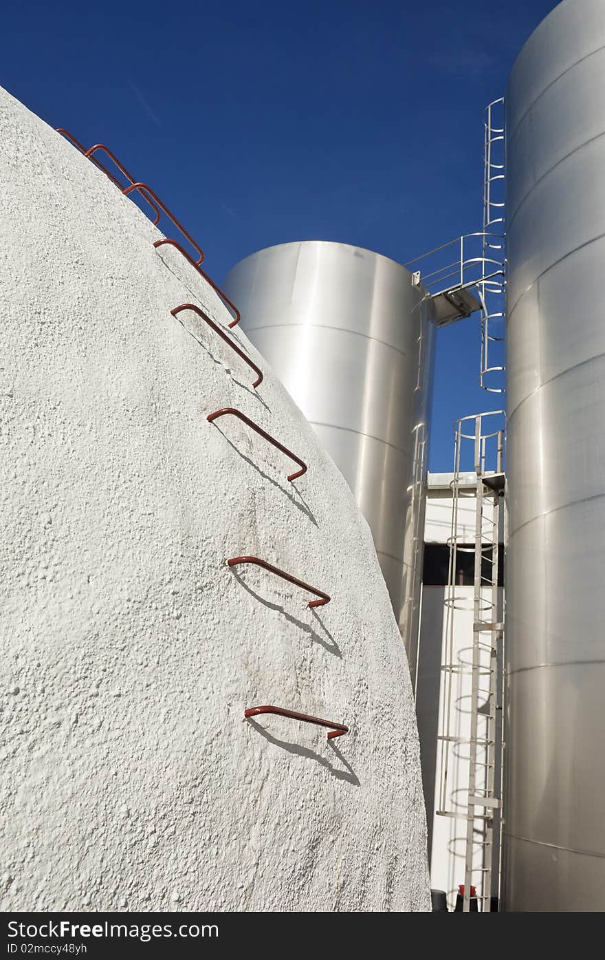 Stainless steel and concrete tanks in a winery, Alentejo, Portugal