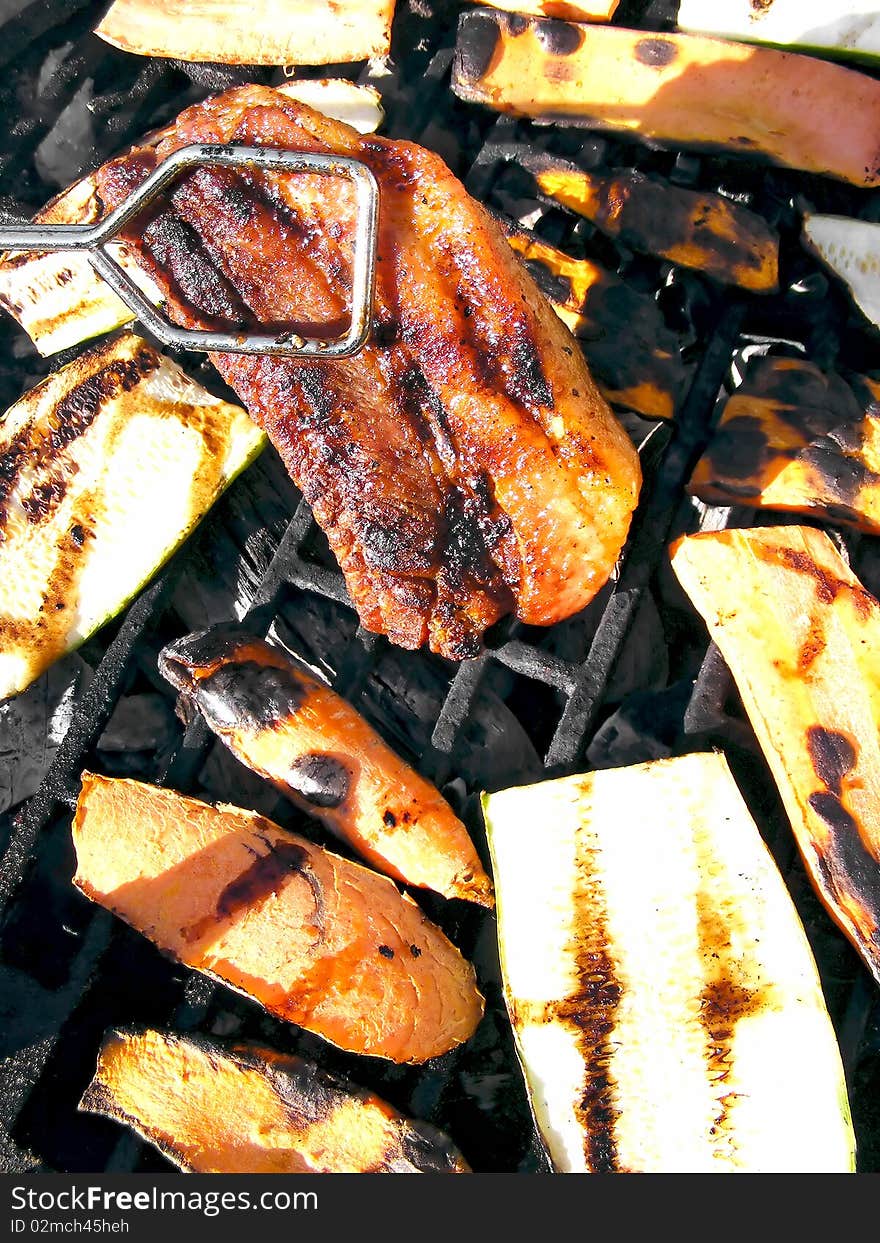 Sausage on barbecue with wooden coals - close up. Sausage on barbecue with wooden coals - close up