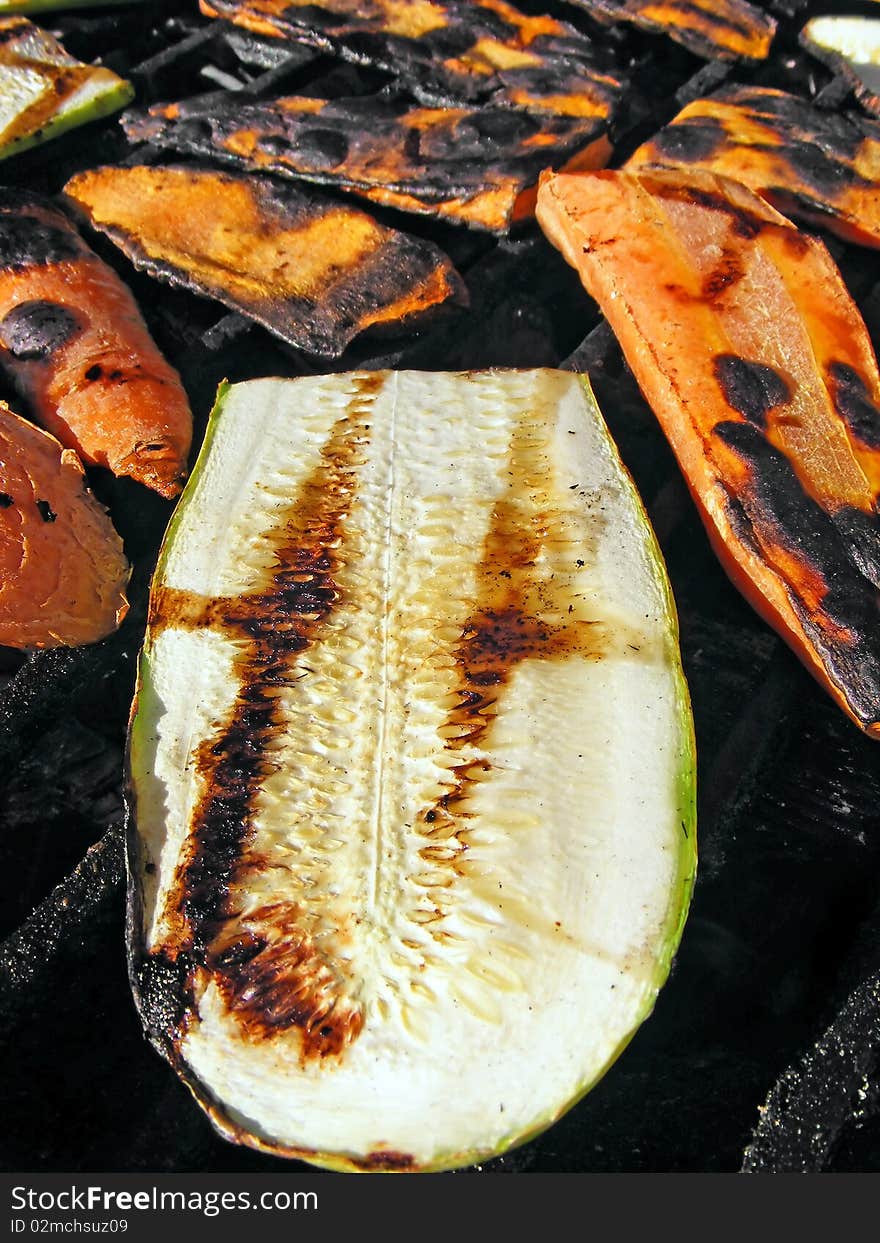 Sausage on barbecue with wooden coals - close up. Sausage on barbecue with wooden coals - close up