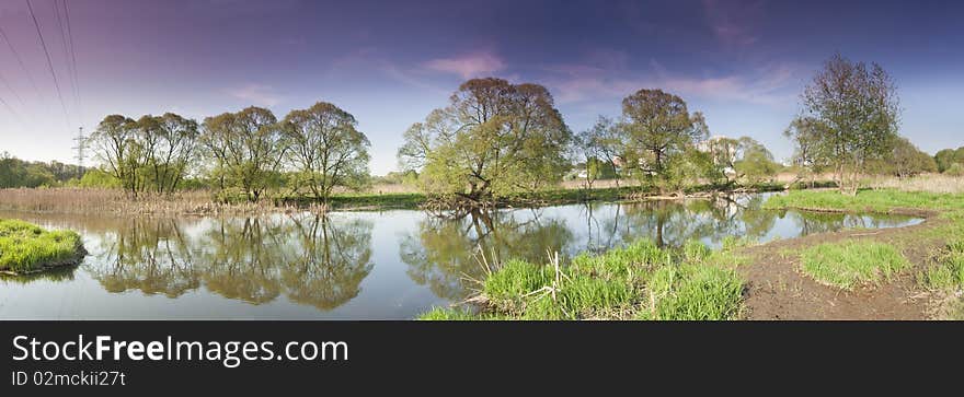 Panorama of the river with reflexion of trees in water. Panorama of the river with reflexion of trees in water