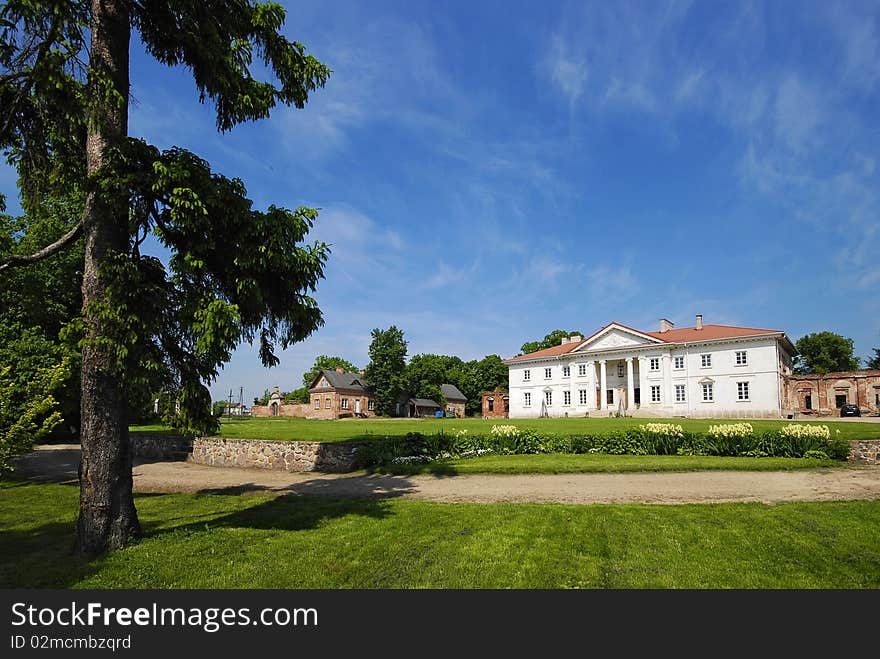 Palace during the repair with the garden into a sunny day. Palace during the repair with the garden into a sunny day