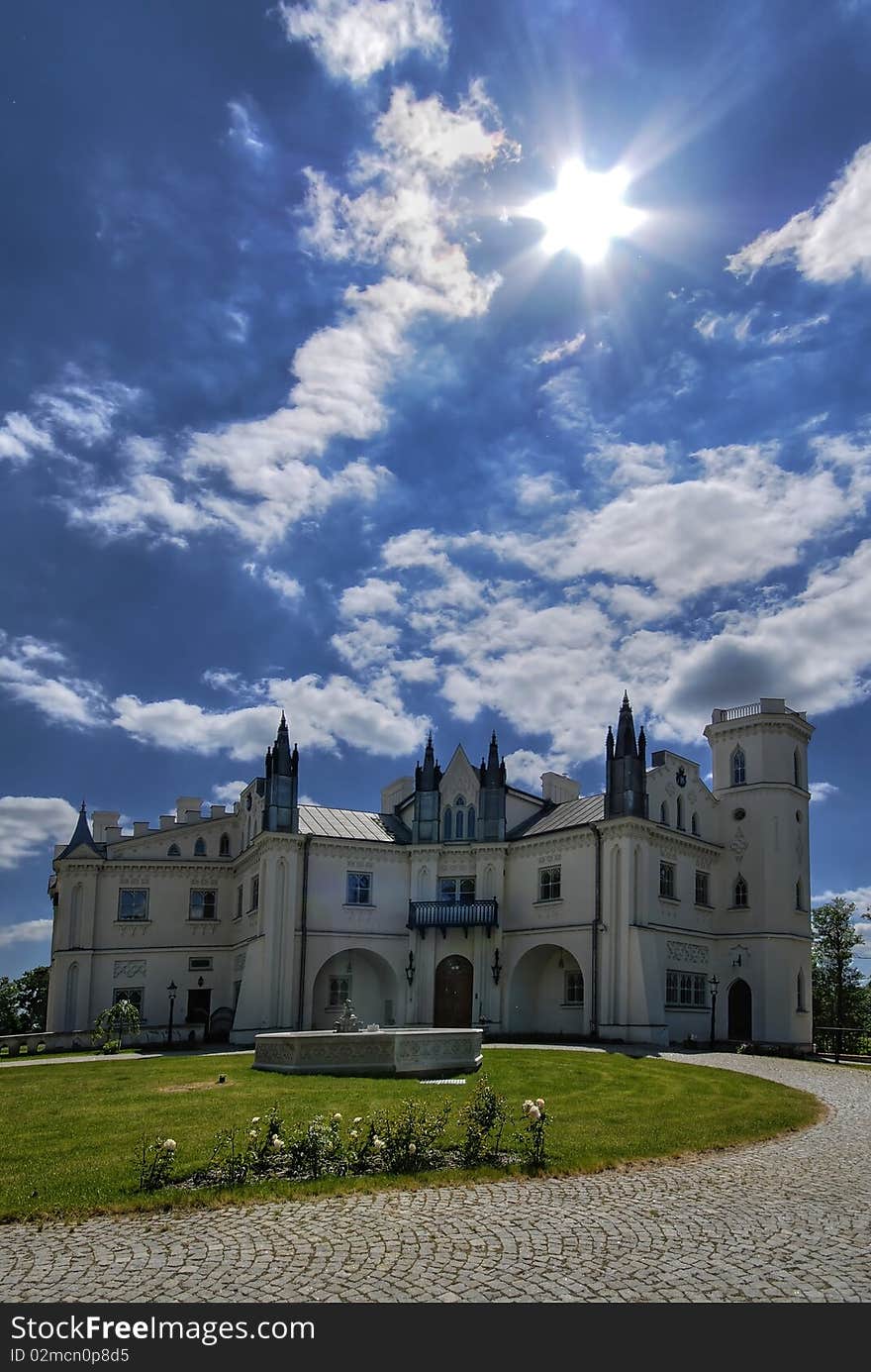 Gothic palace with the garden into a sunny day. Gothic palace with the garden into a sunny day