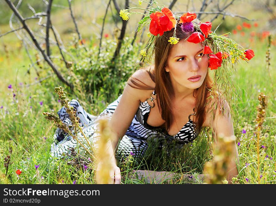 Woman and circlet of flowers