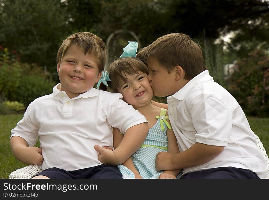 Brothers and sister enjoying each other's company. Brothers and sister enjoying each other's company