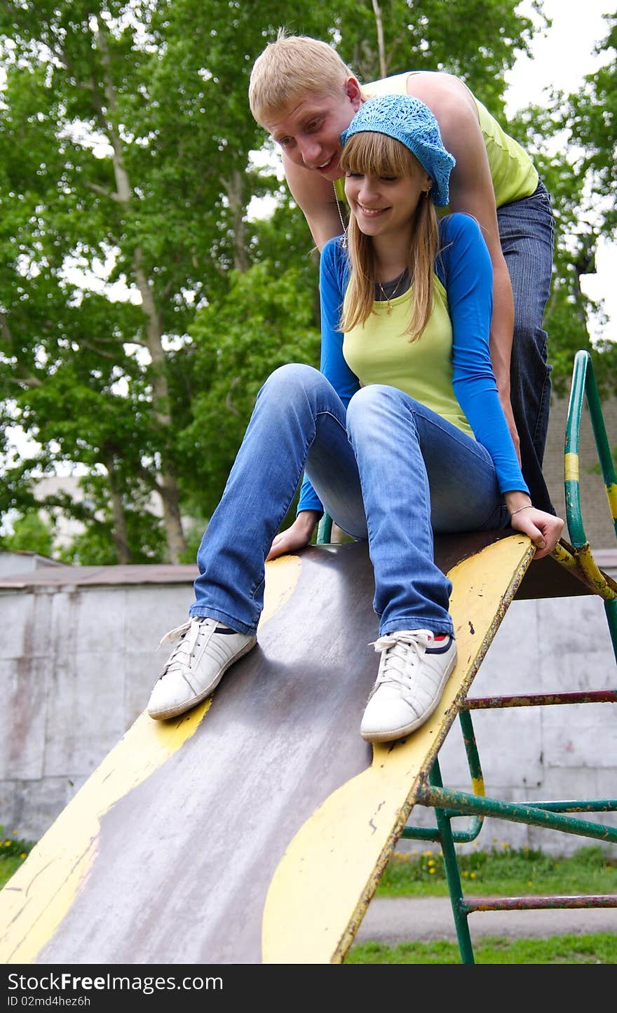 Young man and the woman play together outside. Young man and the woman play together outside