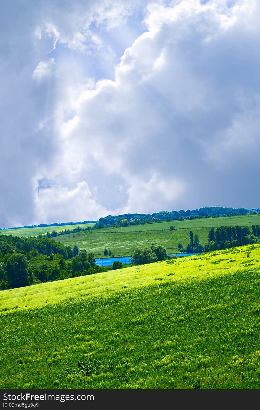 Green hills under the blue summer skies