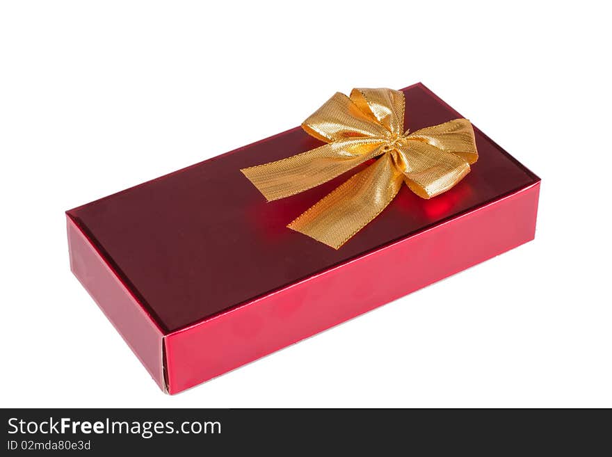 One red gift box with gold ribbon and bow isolated