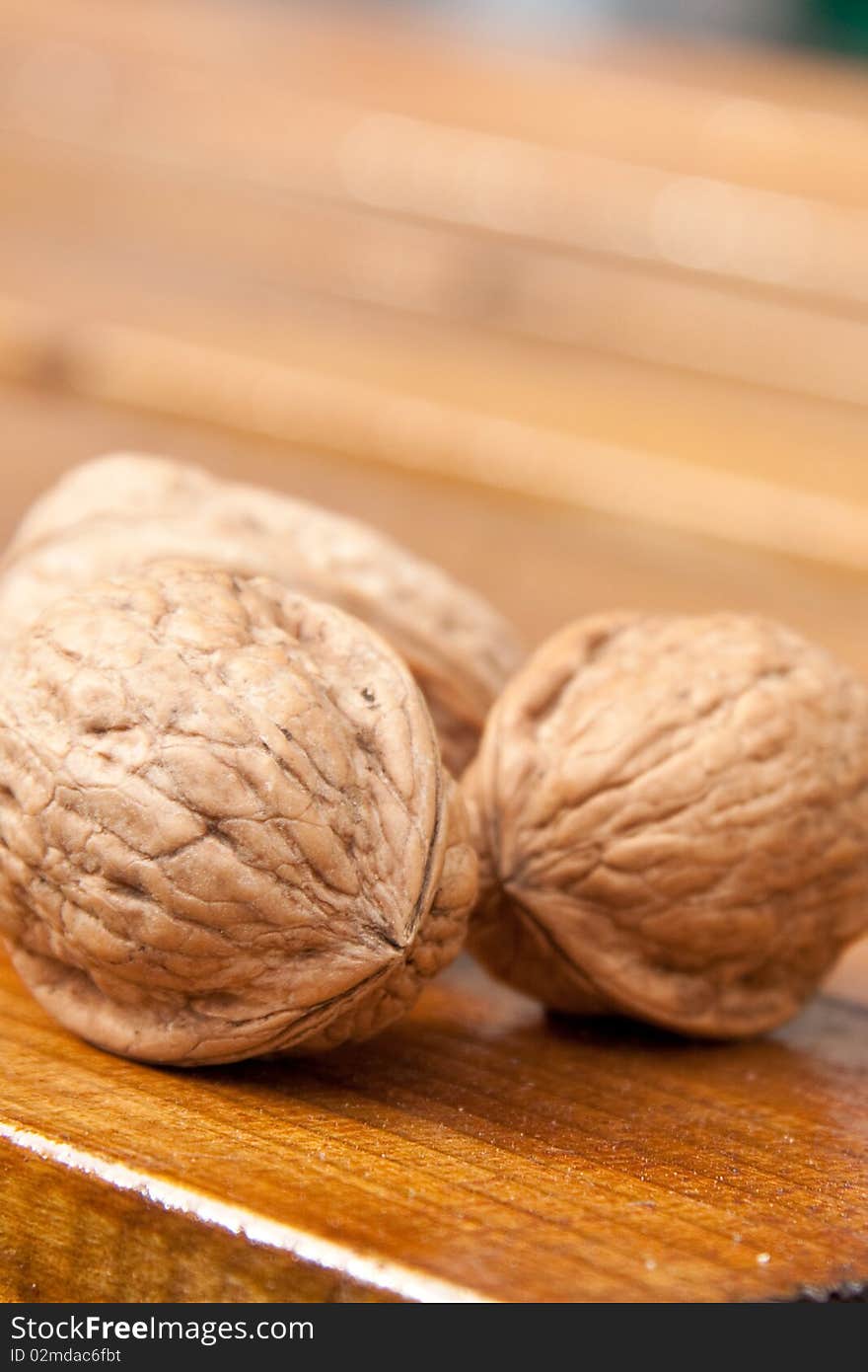 Fresh walnuts laying on the wooden table