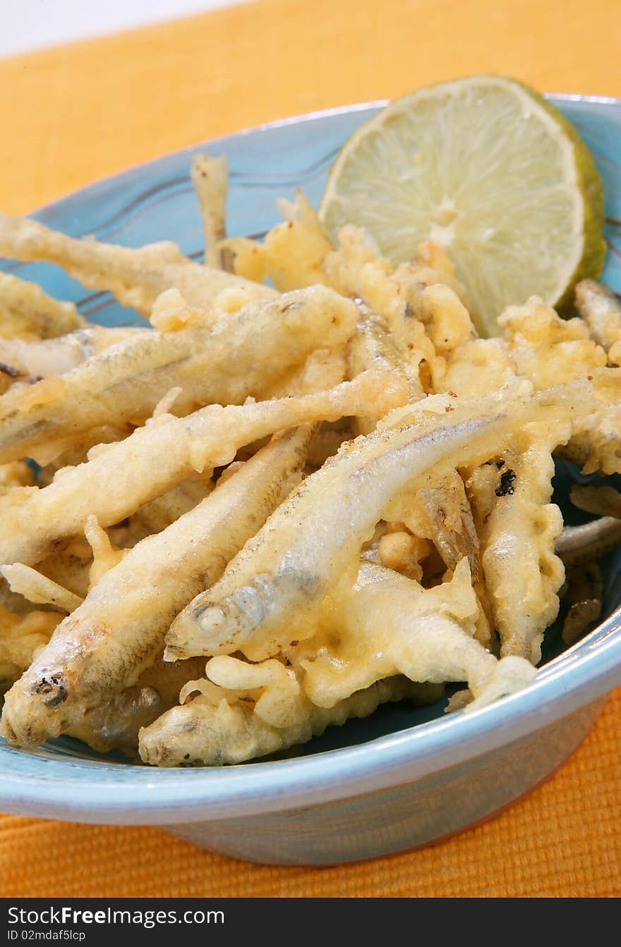 Delicious fresh fried fish on plate with lemon. Delicious fresh fried fish on plate with lemon