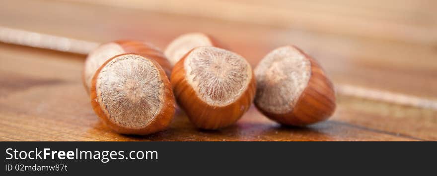 A few hazelnuts laying on the table