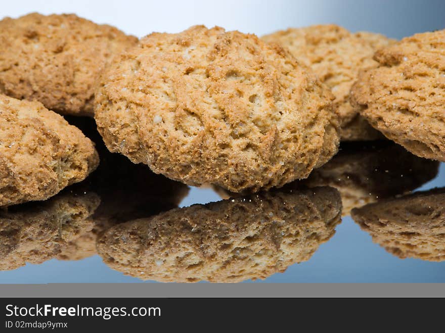 Oaten cookies on reflective surface