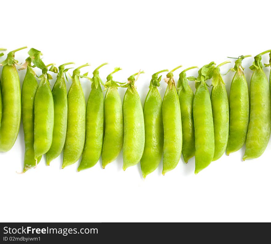 Green peas pods on a white background